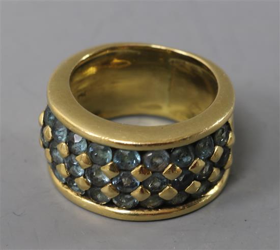 An 18ct gold and blue topaz? pave set ring, size L.